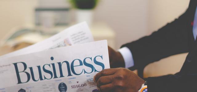 Business Person Reading Newspaper